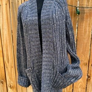 Free People heavy cable-knit cardigan.